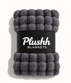 The Cloud Quilt in Charcoal, rolled