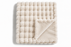 The Cloud Quilt in Ivory, folded
