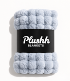 The Cloud Quilt in Icy Blue, rolled